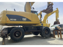 حفاره عجلات CAT 318 2012 بحالة ممتازه الصبغ الأصلي